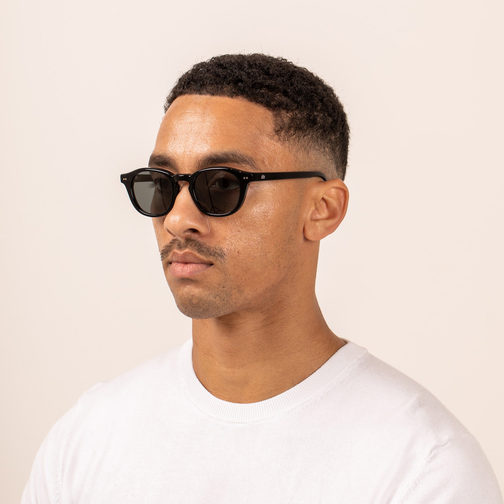 Sito Shades Elio Mens Sunglasses handcrafted from Plant Based acetate in black with polarised lenses - side view on model