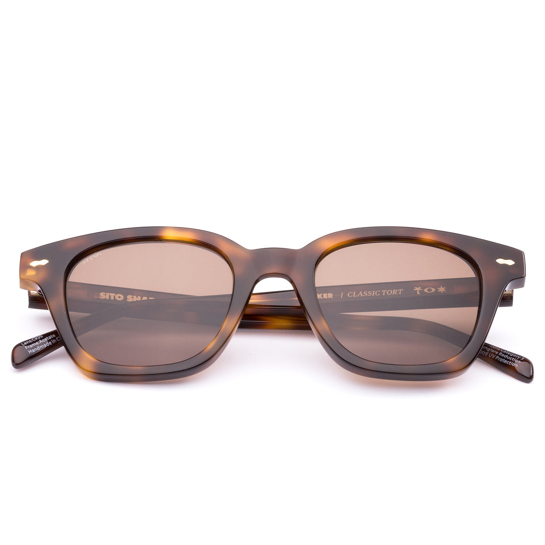 Flat lay of Classic Tort coloured Ryker square sunglasses by Sito Shades on white background.