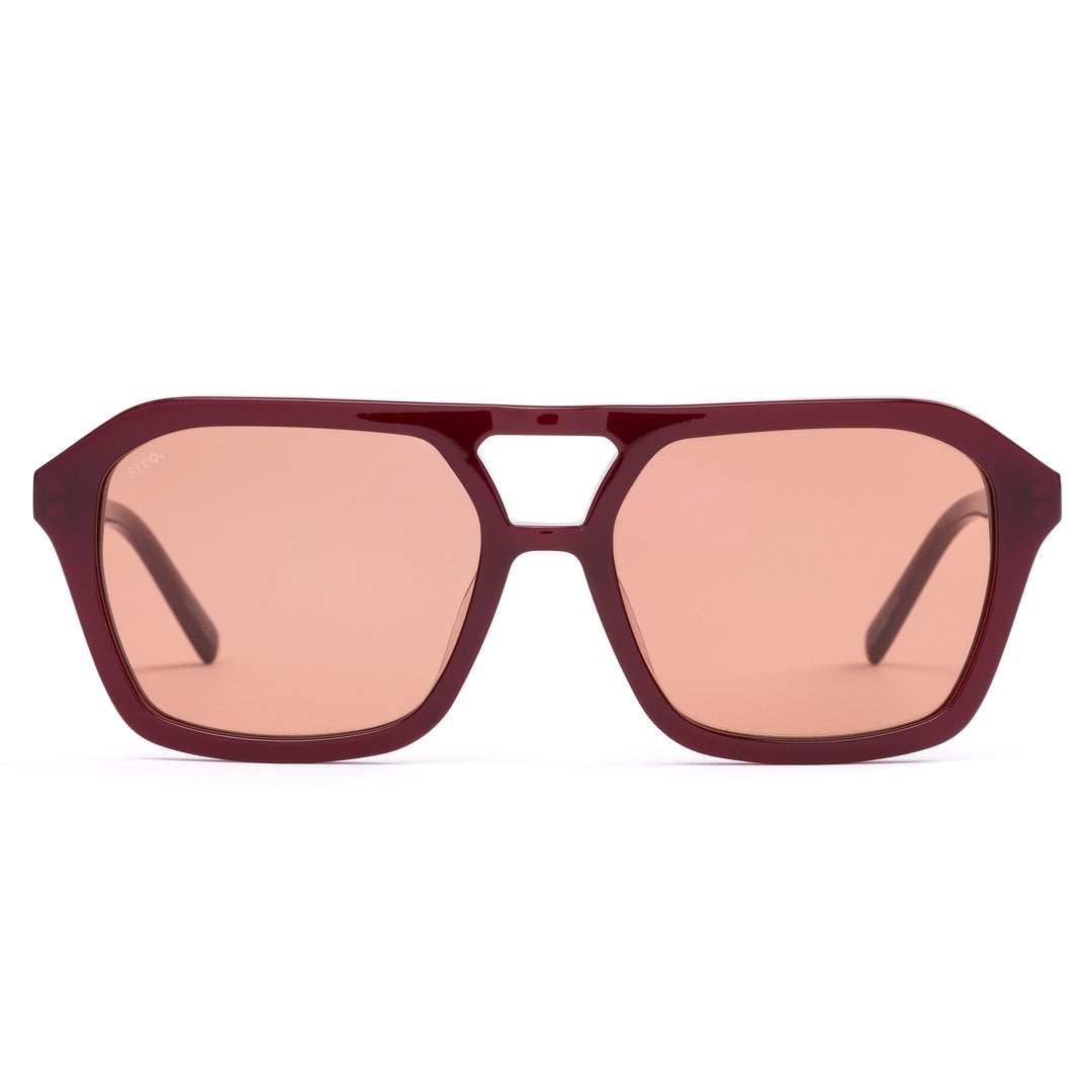 Dark red aviator sunglasses on white background.